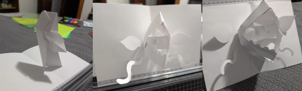 Three prototype pop-up plants on plain white paper.